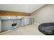 Bright, airy loft space with modern railing, wooden beam and cozy beanbag chair at 16525 Tulloch Rd, Charlotte, NC 28278