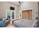 Main bedroom boasting double doors to a deck, a sliding barn door, and a comfortable couch at 16525 Tulloch Rd, Charlotte, NC 28278