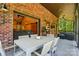 Spacious screened porch with outdoor dining table and comfortable seating area at 16525 Tulloch Rd, Charlotte, NC 28278