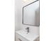 Bathroom featuring white vanity, gray hardware, modern faucet and mirror at 1724 Dallas Ave, Charlotte, NC 28205