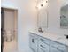 Bright bathroom featuring double vanity, arched mirrors and modern fixtures at 1724 Dallas Ave, Charlotte, NC 28205