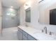 Modern bathroom features double vanity, gray subway tile and updated fixtures at 1724 Dallas Ave, Charlotte, NC 28205