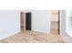 Bedroom with hardwood floors, black doors, white trim and natural lighting at 1724 Dallas Ave, Charlotte, NC 28205