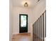 Bright entryway features a stylish black front door and hardwood floors at 1724 Dallas Ave, Charlotte, NC 28205