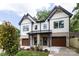 Beautiful two-story townhouse with a modern design, landscaped front yard, and stylish architectural details at 1724 Dallas Ave, Charlotte, NC 28205