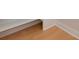 View of light colored wood flooring and white baseboards at 1724 Dallas Ave, Charlotte, NC 28205
