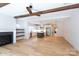 Open-concept living space with fireplace, built-ins, and adjacent kitchen, perfect for modern living and entertaining at 1724 Dallas Ave, Charlotte, NC 28205