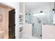 Bathroom with glass-enclosed shower and built-in shelves, plus a toilet and sink at 1728 Dallas Ave, Charlotte, NC 28205