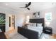 Stylish main bedroom featuring a large bed and a view to an organized storage room at 1728 Dallas Ave, Charlotte, NC 28205