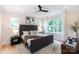 Bright main bedroom featuring large windows, hardwood floors, and modern decor at 1728 Dallas Ave, Charlotte, NC 28205