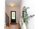 Entryway with a black door, and mirror, accented with modern lighting and a 'Welcome' mat at 1728 Dallas Ave, Charlotte, NC 28205