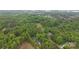 Lush green landscape featuring the property, with mature trees and a winding road at 17403 Green Hill Rd, Charlotte, NC 28278