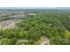 A distant aerial view shows the neighborhood surrounded by trees, with a beautiful scenery at 17403 Green Hill Rd, Charlotte, NC 28278