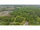 An aerial view shows the property with mature trees, and a long driveway at 17403 Green Hill Rd, Charlotte, NC 28278