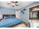 Cozy bedroom featuring a ceiling fan, closet and blue bedding and walls at 17403 Green Hill Rd, Charlotte, NC 28278