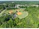 Aerial view of a community's baseball fields surrounded by mature trees and parking at 185 Willow Valley Dr, Mooresville, NC 28115