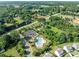 Aerial view of community pool surrounded by lush greenery and trees, close to residential area at 185 Willow Valley Dr, Mooresville, NC 28115