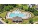 Aerial view of the pool and clubhouse area with manicured landscaping and nearby residences at 185 Willow Valley Dr, Mooresville, NC 28115