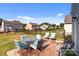Backyard with a well-maintained lawn, a patio with outdoor furniture, and a fence at 185 Willow Valley Dr, Mooresville, NC 28115