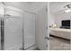 Bright bathroom features a glass enclosed walk-in shower and access to the main bedroom at 185 Willow Valley Dr, Mooresville, NC 28115