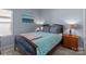 Cozy bedroom with a decorative painting, lamps, and wooden furniture at 185 Willow Valley Dr, Mooresville, NC 28115