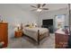 Charming bedroom features a cozy ambiance with neutral tones, ceiling fan, and natural light for relaxation at 185 Willow Valley Dr, Mooresville, NC 28115