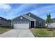 Charming single-Gathering home featuring a two-car garage, well-kept lawn, and inviting front entrance at 185 Willow Valley Dr, Mooresville, NC 28115