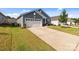 Charming home with a two-car garage, well-manicured lawn, and mature landscaping at 185 Willow Valley Dr, Mooresville, NC 28115