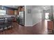 Open-concept kitchen with stainless steel appliances, granite countertops, and wood cabinetry at 185 Willow Valley Dr, Mooresville, NC 28115