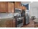 This kitchen showcases stainless steel appliances, stylish cabinets, and granite countertops perfect for culinary endeavors at 185 Willow Valley Dr, Mooresville, NC 28115
