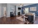 Cozy living room with fireplace, hardwood flooring, and plenty of natural light at 185 Willow Valley Dr, Mooresville, NC 28115