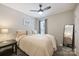 Bright bedroom features a ceiling fan, a neutral color scheme, and comfortable furnishings at 1925 Sandal Brook Rd, Indian Land, SC 29707