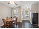 Dining area with hardwood floors, natural light, and views of the front entrance at 1925 Sandal Brook Rd, Indian Land, SC 29707