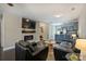 Open living space connects to the kitchen and a view of the electric fireplace and TV at 1925 Sandal Brook Rd, Indian Land, SC 29707