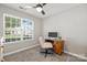 Well-lit office space with a large window providing ample natural light and a cozy work area at 1925 Sandal Brook Rd, Indian Land, SC 29707