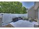 Relaxing patio features comfortable seating, a grill, and green surroundings, ideal for outdoor enjoyment at 1925 Sandal Brook Rd, Indian Land, SC 29707