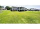 Back exterior featuring a covered deck and spacious backyard at 2031 36Th Ne St, Hickory, NC 28601