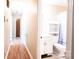 Hallway view leading to the bathroom with vanity, toilet, and shower featuring tiled floors at 2031 36Th Ne St, Hickory, NC 28601