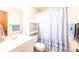 Cozy bathroom with a vanity, sink, toilet, and tub with a shower curtain, complemented by blue accents at 2031 36Th Ne St, Hickory, NC 28601