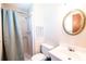 Cozy bathroom featuring a shower with curtain, toilet, and vanity with a round mirror at 2031 36Th Ne St, Hickory, NC 28601