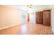 Bright bedroom featuring a window, hardwood floors, a ceiling fan, and a closet for storage and comfortable living at 2031 36Th Ne St, Hickory, NC 28601