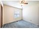 This bedroom features a ceiling fan and a window at 2031 36Th Ne St, Hickory, NC 28601