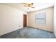 This bedroom features a ceiling fan, a closet, and a window at 2031 36Th Ne St, Hickory, NC 28601