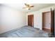 This bedroom features a ceiling fan and a closet with wood doors at 2031 36Th Ne St, Hickory, NC 28601