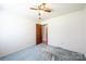 This bedroom features a ceiling fan and an entry door at 2031 36Th Ne St, Hickory, NC 28601