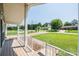 Charming front porch with white railings, offering a view of the well-manicured lawn and quiet neighborhood at 2031 36Th Ne St, Hickory, NC 28601