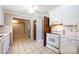 Efficient kitchen featuring white appliances, tile flooring, and ample storage at 2031 36Th Ne St, Hickory, NC 28601