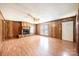 Living room featuring wood paneling, fireplace, and laminate floors at 2031 36Th Ne St, Hickory, NC 28601
