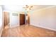 Spacious main bedroom with en suite bath, hardwood flooring, and ceiling fan at 2031 36Th Ne St, Hickory, NC 28601