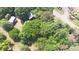 Lush, green trees and a charming house from an aerial view at 2131 E Nc 10 Hwy, Conover, NC 28613